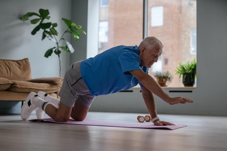 older man working out at home