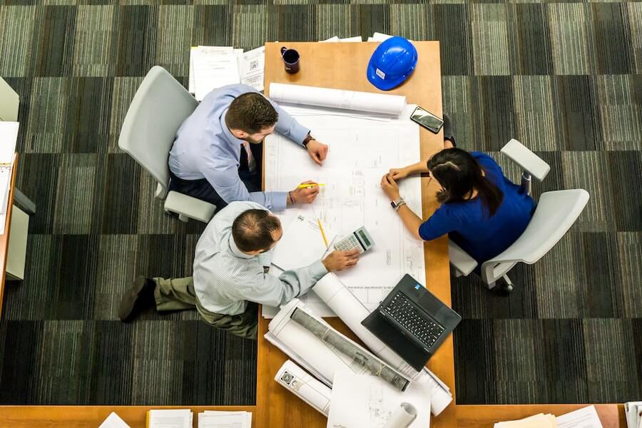 employees talking with manager with the skills to manage a team