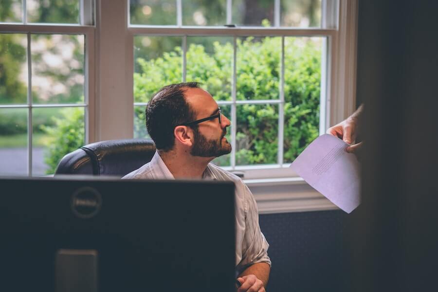 employee in an office talking with their manager