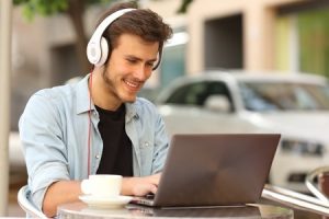 man studying at home on laptop