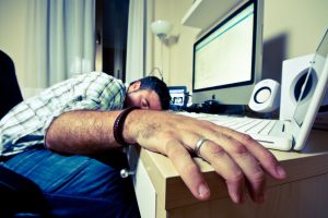 man asleep at desk