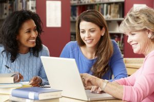 Mature students working in successful learning environments in the library