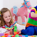 3 children playing with toys