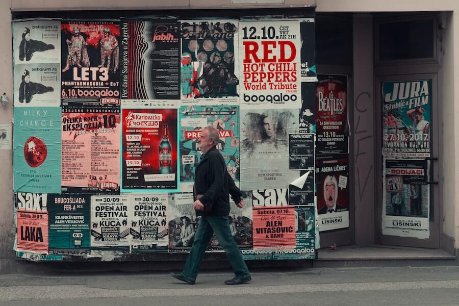 offline marketing posters hanging on street wall