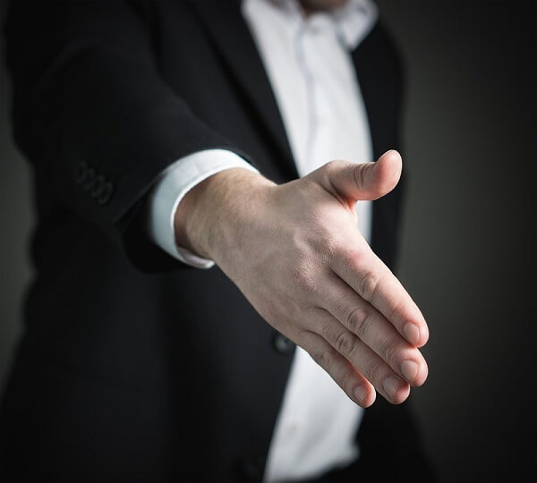 man preparing to shake hands