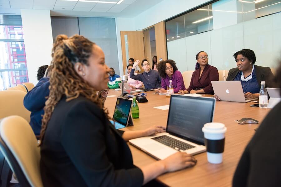 group of people in a meeting with face to face learning