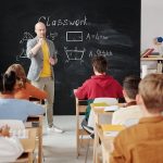 a teacher asking a question in a classroom