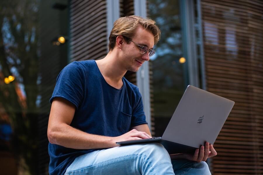 man studying on his laptop without a-levels