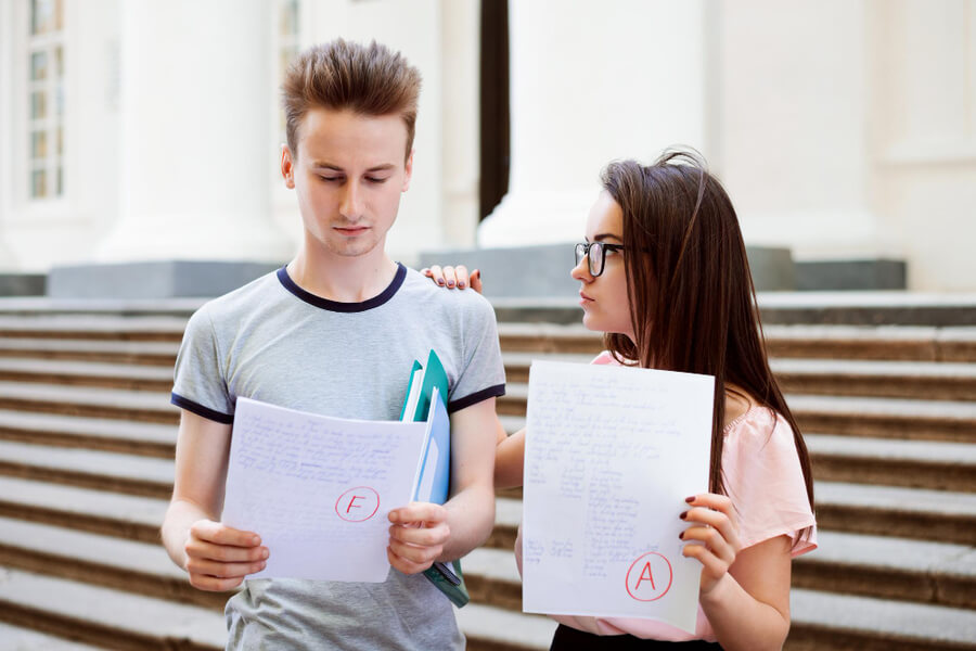students holding gcse exam results