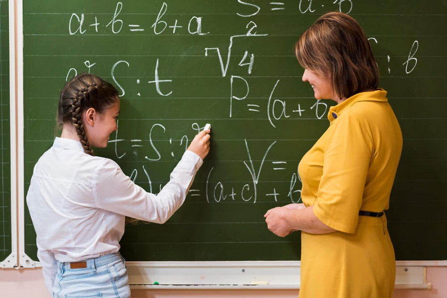 maths teacher helping student