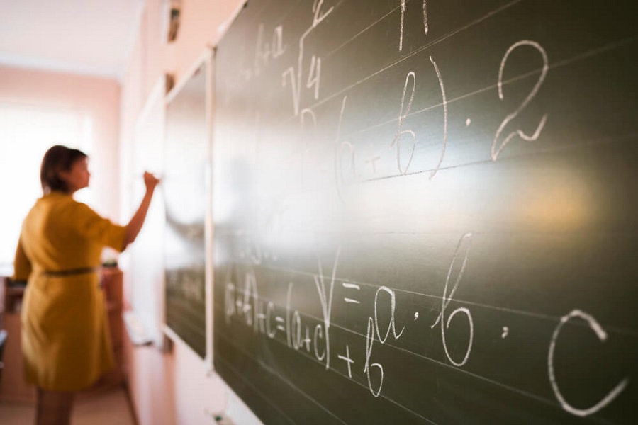 becoming a maths teacher writing on chalkboard