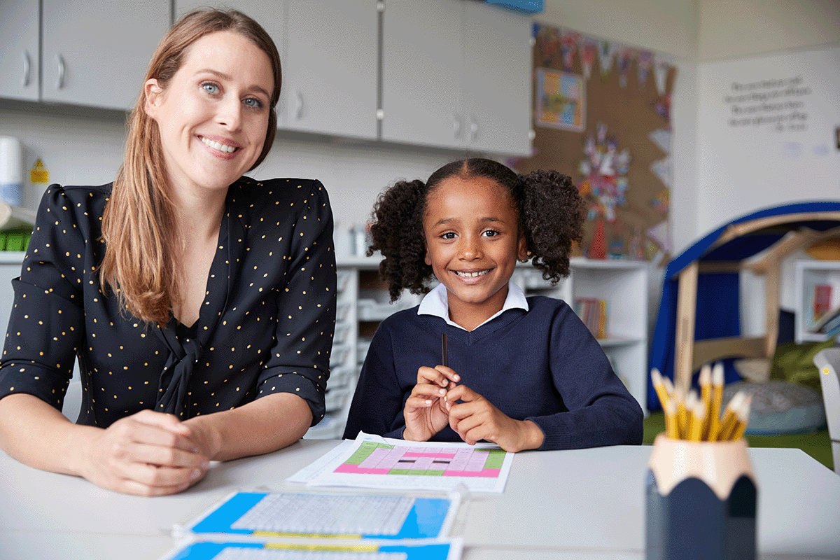 Female teacher with a female student