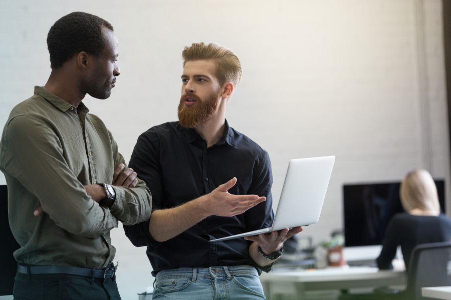 two men explaining a point to each other