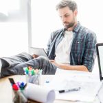man at work in an office avoiding work