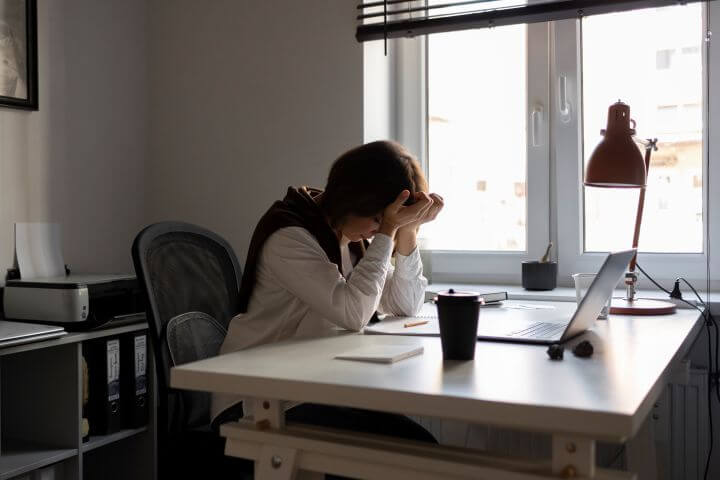 woman distressed at work