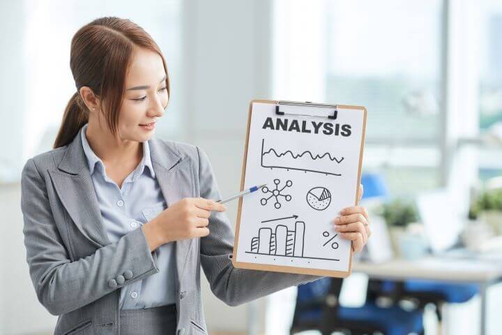 woman in suit with clipboard