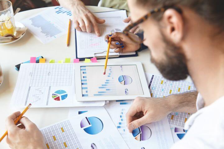 team working on graphs in workplace