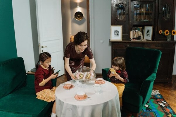 A Childminder serving cake to kids